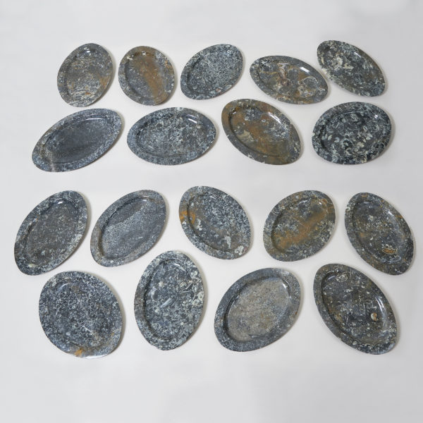Polished limestone oval plates with fossilised inclusions