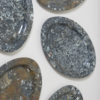Polished limestone oval plates with fossilised inclusions