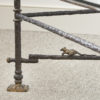 Glass mounted parcel-gilt wrought iron coffee table in the manner of Diego Giacometti