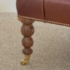 West Sussex-made buttoned leather and black American walnut ottoman