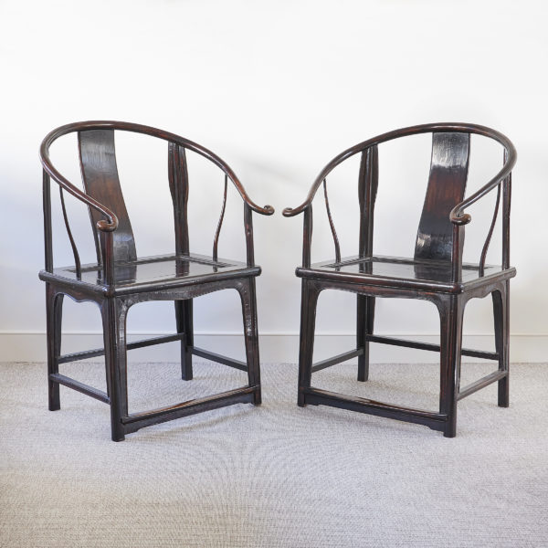 Pair of Chinese ebonised horseshoe back chairs of large scale