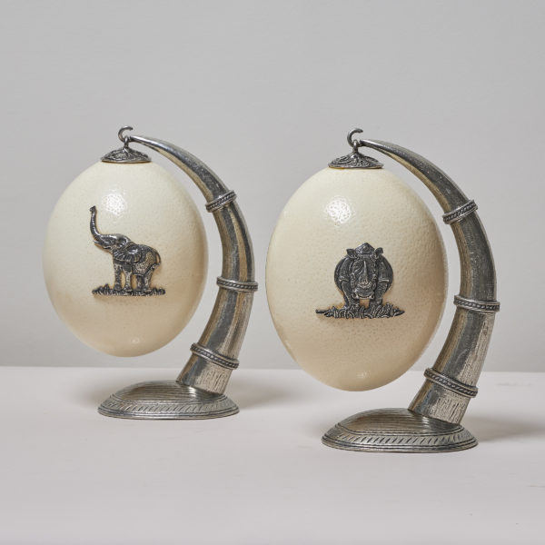 Pair of silver-mounted ostrich eggs on hanging stands