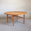 Circular teak coffee table with rattan undertier by Johannes Andersen for CFC Silkeborg, 1960s