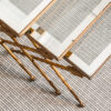 Nest of three gilt wrought iron and glass arrow side tables, c. 1930