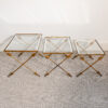 Nest of three gilt wrought iron and glass arrow side tables, c. 1930
