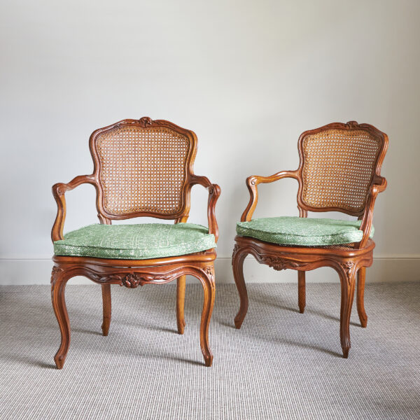 Pair of Louis XVI walnut and cane chairs