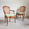 Pair of Louis XVI walnut and cane chairs