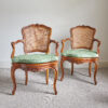 Pair of Louis XVI walnut and cane chairs