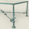 Green patinated bronze coffee table in the style of Giacometti