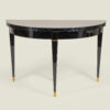 French Mid Century black lacquer fold-over demilune table in the manner of Andre Arbus, c. 1950